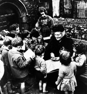 Italian educator Maria Montessori is surrounded by children as she visits a Montessori school in London, England, sometime in the late 1940s. (AP Photo)